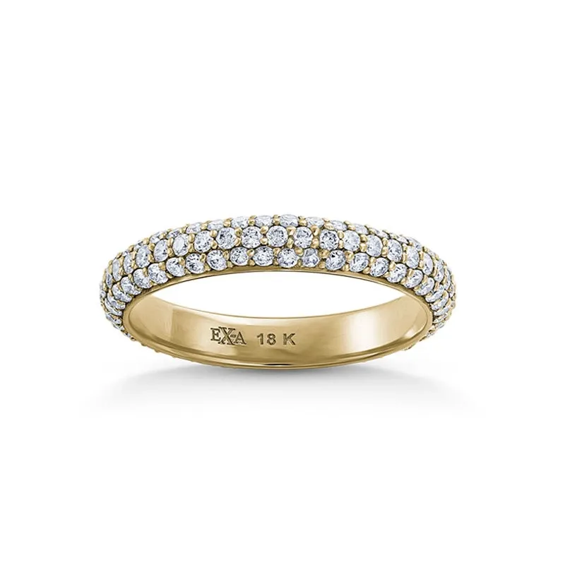 A stunning gold wedding band designed by Ex Aurum Jewelers, categorized under Wedding Jewelry, featured on Mariage Elegant, Canada. The ring is crafted from 18k gold and elegantly encrusted with three rows of sparkling diamonds, offering a luxurious and timeless look for any wedding occasion. The interior of the band is engraved with 'EXA 18K,' indicating its material and authenticity. This exquisite piece symbolizes elegance and commitment, perfect for adorning the finger of a betrothed couple.