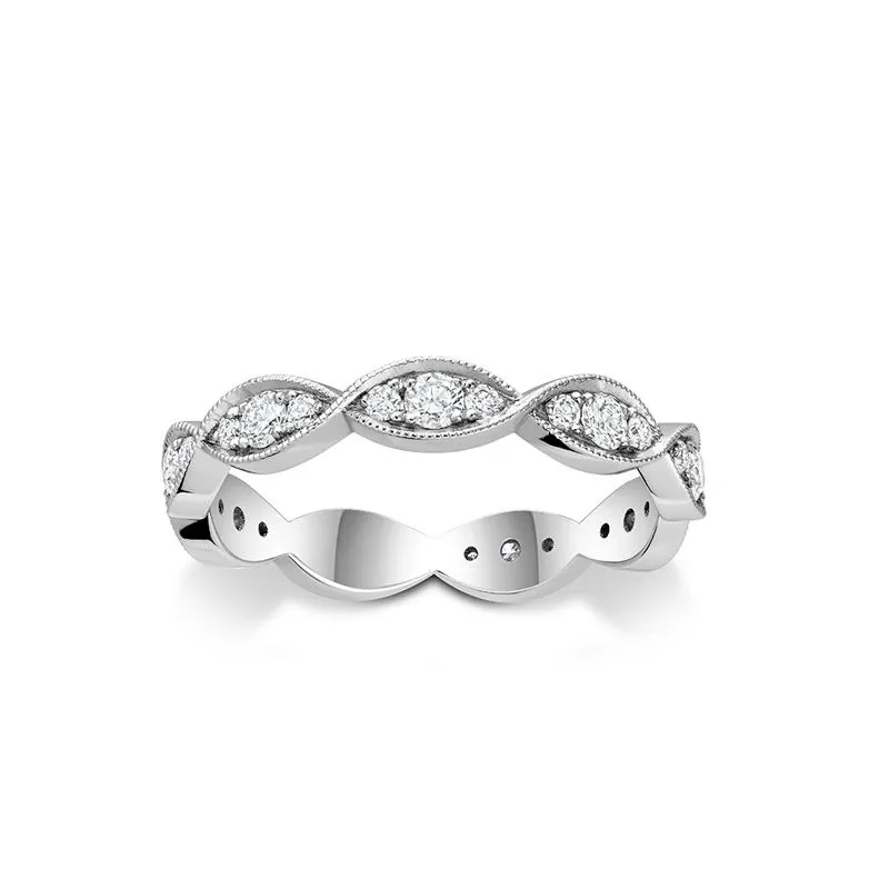 This image showcases a stunning wedding band from Ex Aurum Jewelers, categorized under Wedding Jewelry on Mariage Elegant, Canada. The ring features an intricate design with a series of sparkling round diamonds set in an elegant marquise-shaped pattern around the band. The polished silver setting enhances the brilliance of the diamonds, making it an ideal choice for brides seeking timeless elegance on their special day.