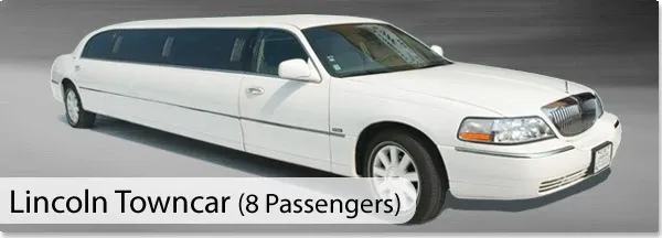 The image features a luxurious white Lincoln Towncar limousine, designed to accommodate eight passengers, perfect for weddings. This elegant vehicle, provided by CM Limo, is ideal for bridal parties seeking a sophisticated and comfortable ride. The limousine is in excellent condition, with polished exteriors and tinted windows, suitable for making a grand entrance or exiting the wedding venue. The background displays a smooth gradient, highlighting the sleek design of the wedding limousine.