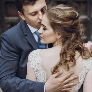 happy wedding couple hugging and embracing at old castle