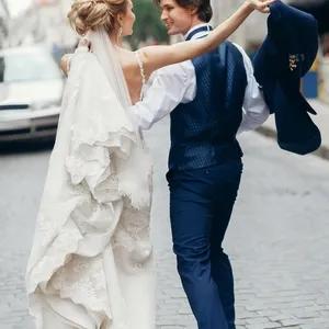 bride and groom dancing and having fun in city street