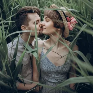 stylish rustic bride and groom embracing in windy high reed 1